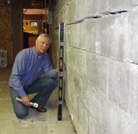 Dale inspecting wall