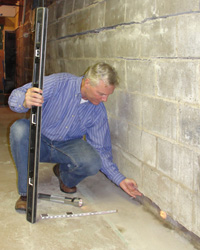 Dale inspecting wall