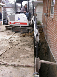 Excavating basement wall